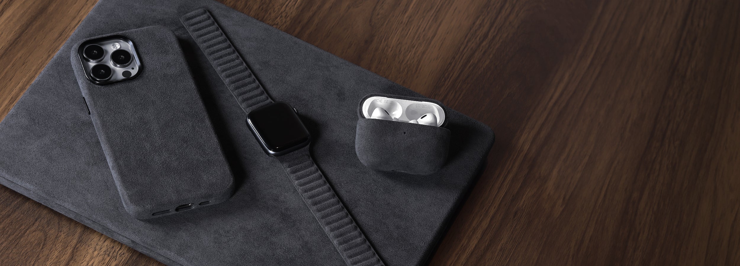 Komodoty-Alcantara-MacBook-Pro-iPhone-15-Pro-Max-AirPods-Pro-Cases-Apple-Watch-Band-Black-Banner