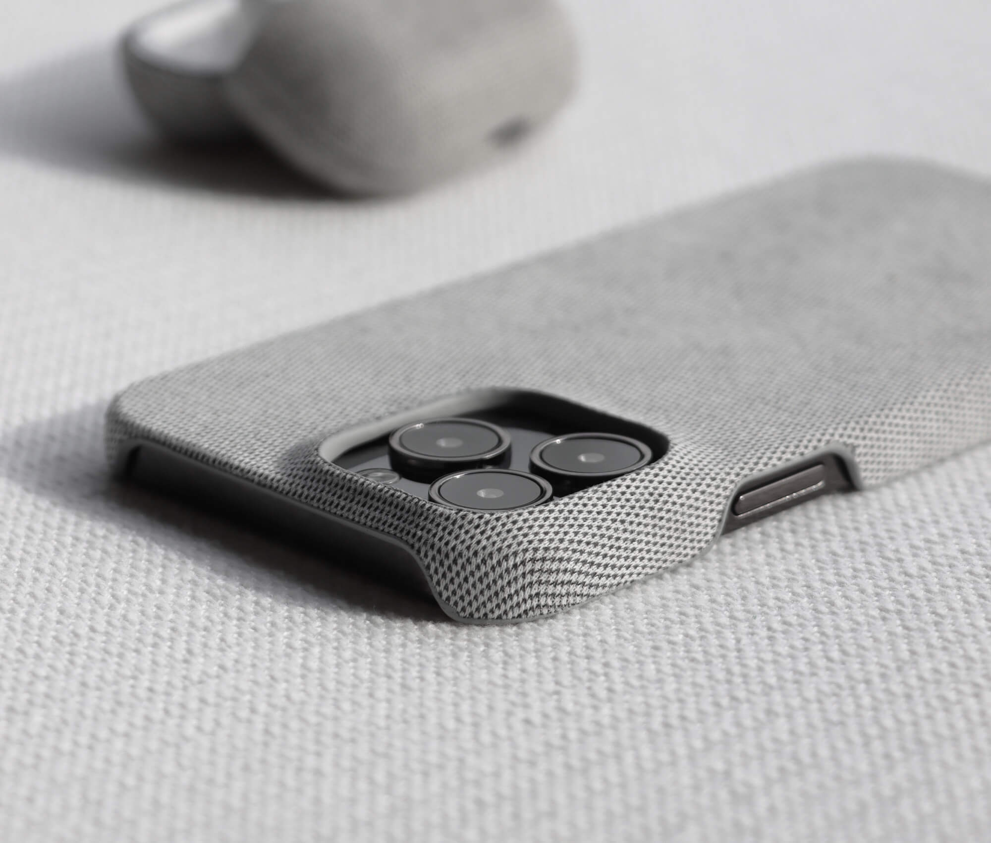 Komodoty Fabric iPhone 15 Pro Max Case Light Grey Slim Design Camera Protection Open Cutouts Close Up
