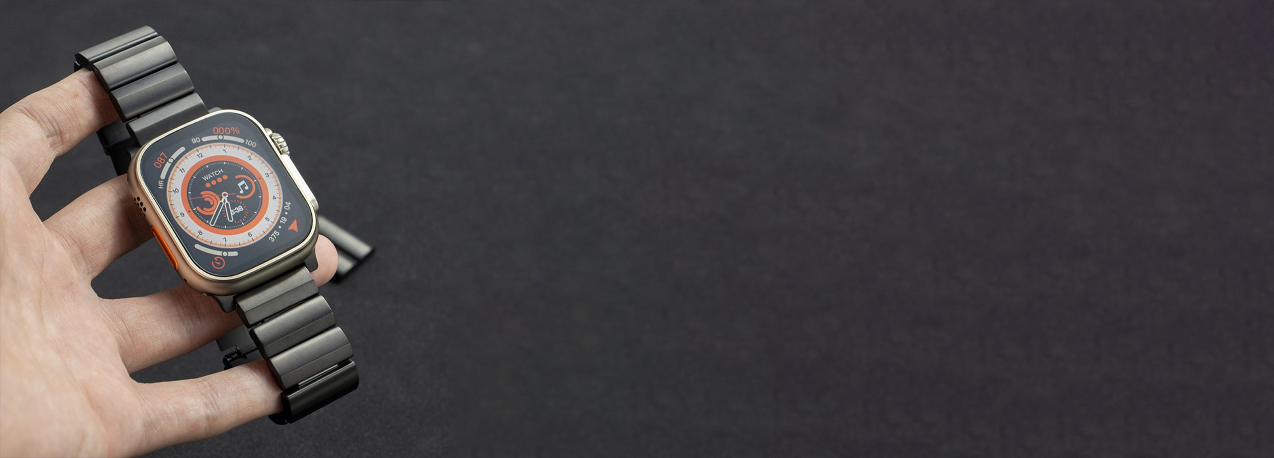 Komodoty Titanium Apple Watch Band Hand holding Black Titanium Apple Watch banner