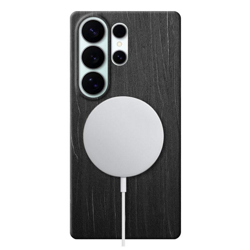 Samsung Galaxy S26 Ultra black wood phone case with MagSafe charger attached on white background