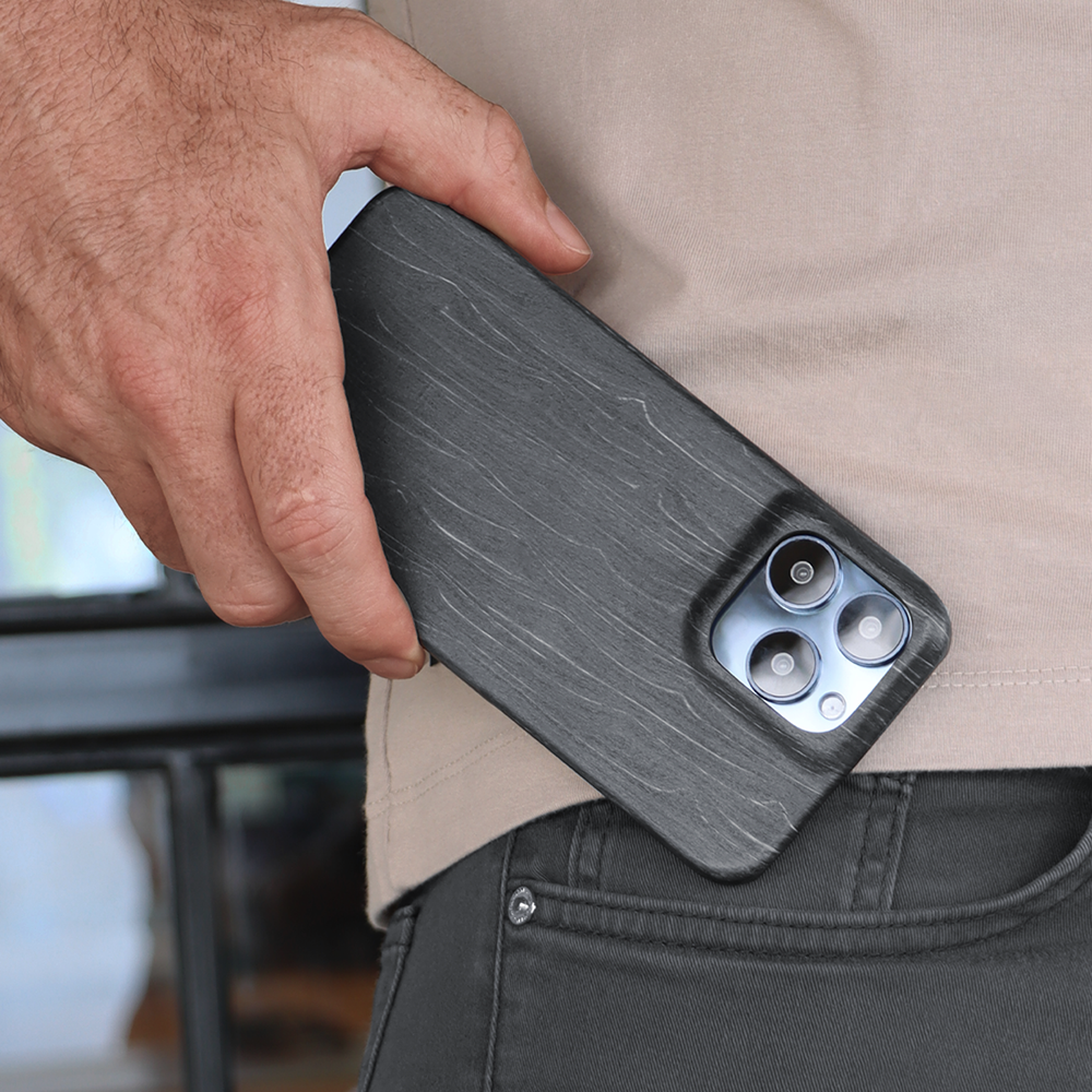 Komodoty Komodo Slim Wood iPhone Charcoal Man putting in his pocket 1000x1000