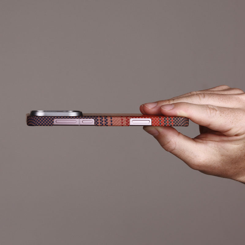 Oppo Find X9 Pro aramid fiber phone case held on the side to show the thin design against a gray background